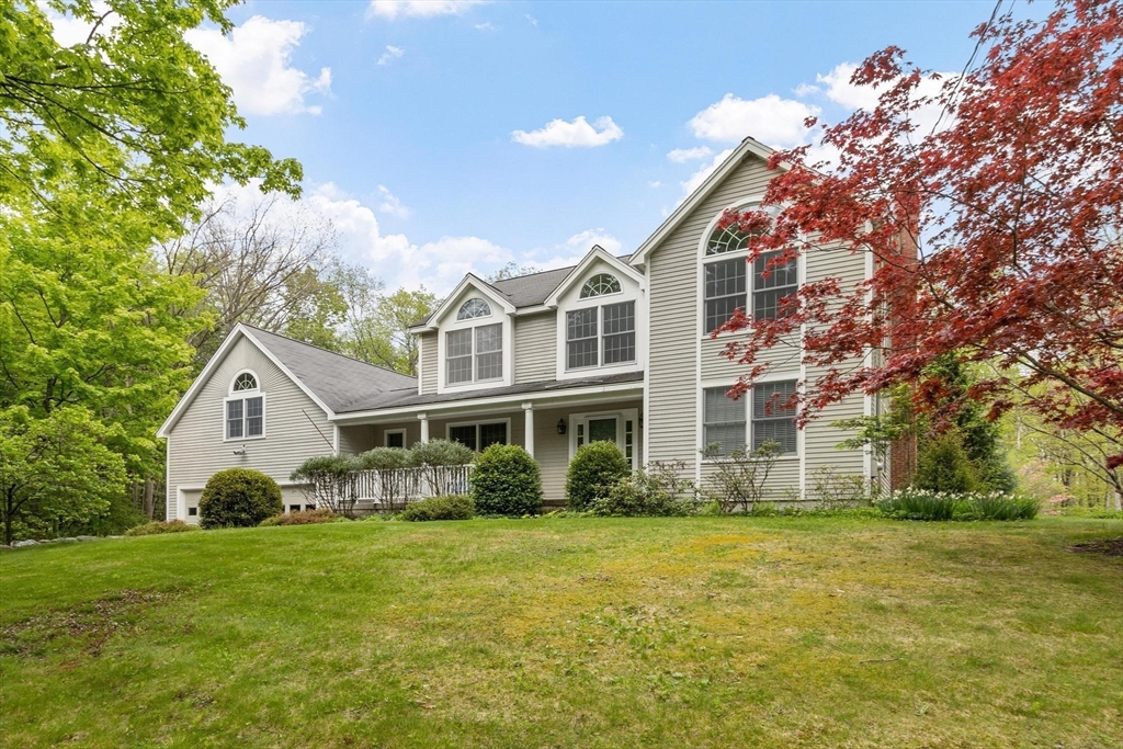 94 Turner Road Townsend, MA 01469 - Photo 30 of 42 a front view of a house with a garden