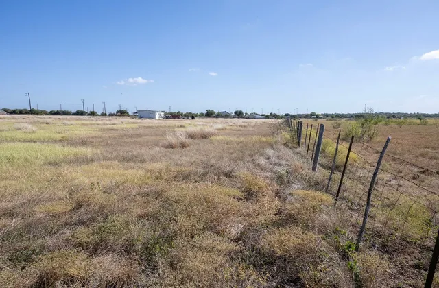 a view of lake with green space