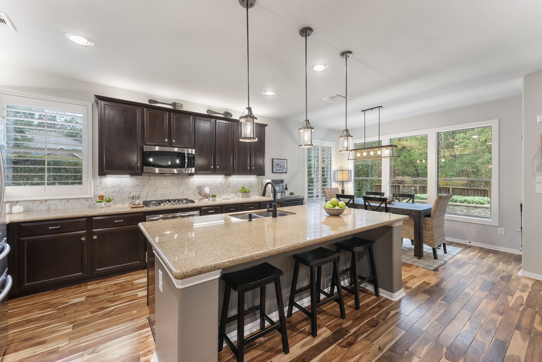 27614 Colin Springs Lane Spring, TX 77386 - Photo 14 of 47 Highly functional kitchen with abundant cabinetry for storage, double ovens, a 5-burner gas cooktop, undermount and upper accent lighting, and a walk-in pantry!
