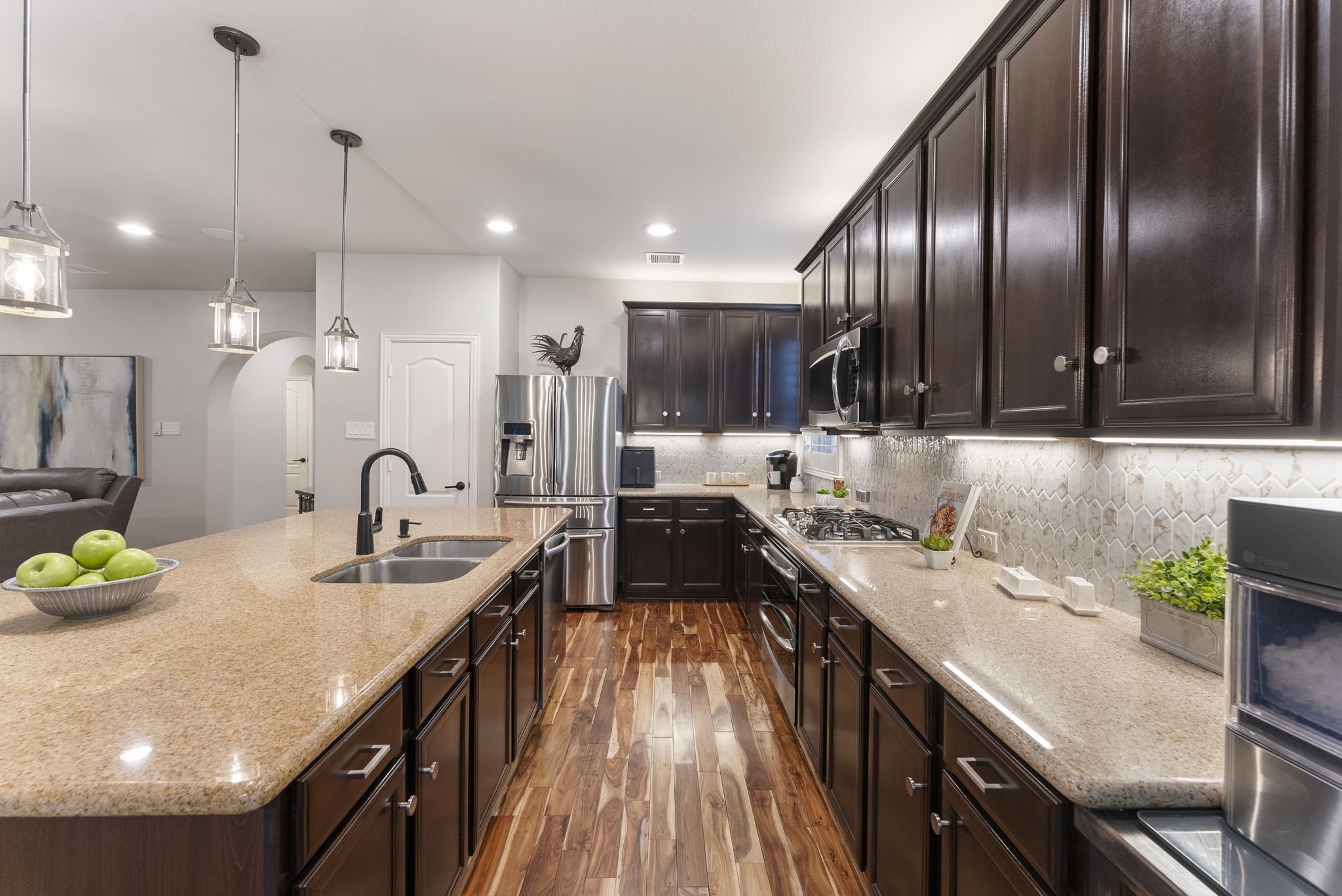 27614 Colin Springs Lane Spring, TX 77386 - Photo 15 of 47 Recent kitchen updates include designer backsplash, plumbing fixtures, lighting fixtures, and cabinetry hardware!