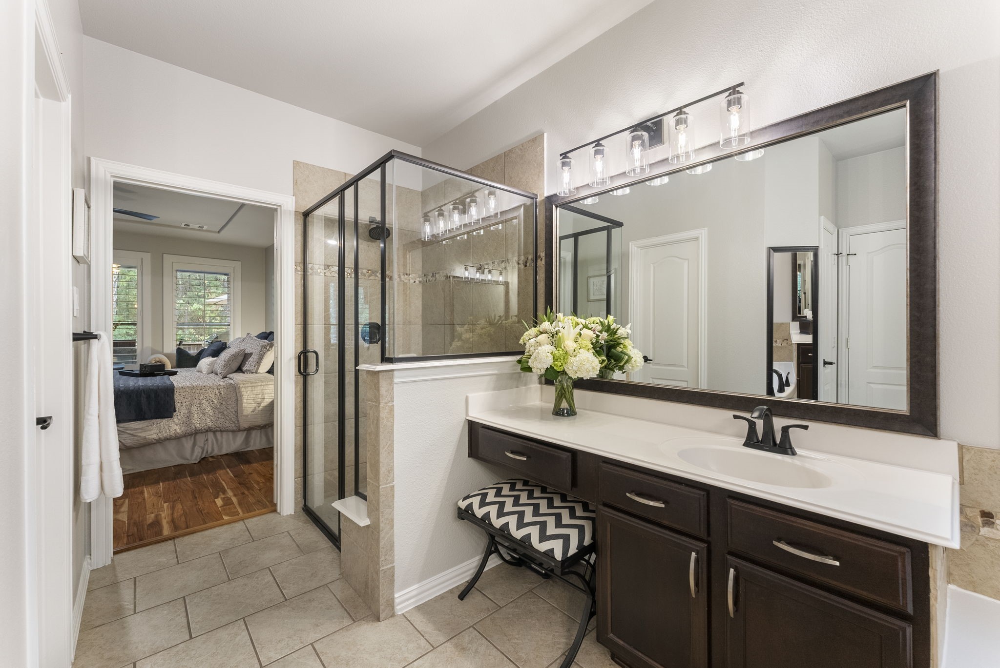 27614 Colin Springs Lane Spring, TX 77386 - Photo 20 of 47 Primary Bath also features walk-in shower with built-in bench, seated vanity area, linen closet, and a large walk-in primary closet!