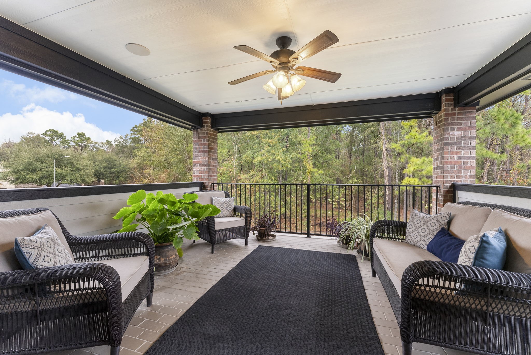 27614 Colin Springs Lane Spring, TX 77386 - Photo 24 of 47 Look at that AMAZING view! This large balcony features tile flooring, ceiling fan, and ceiling speakers, offering the perfect retreat for serenity, refreshing breezes, and stunning wooded Greenbelt views!