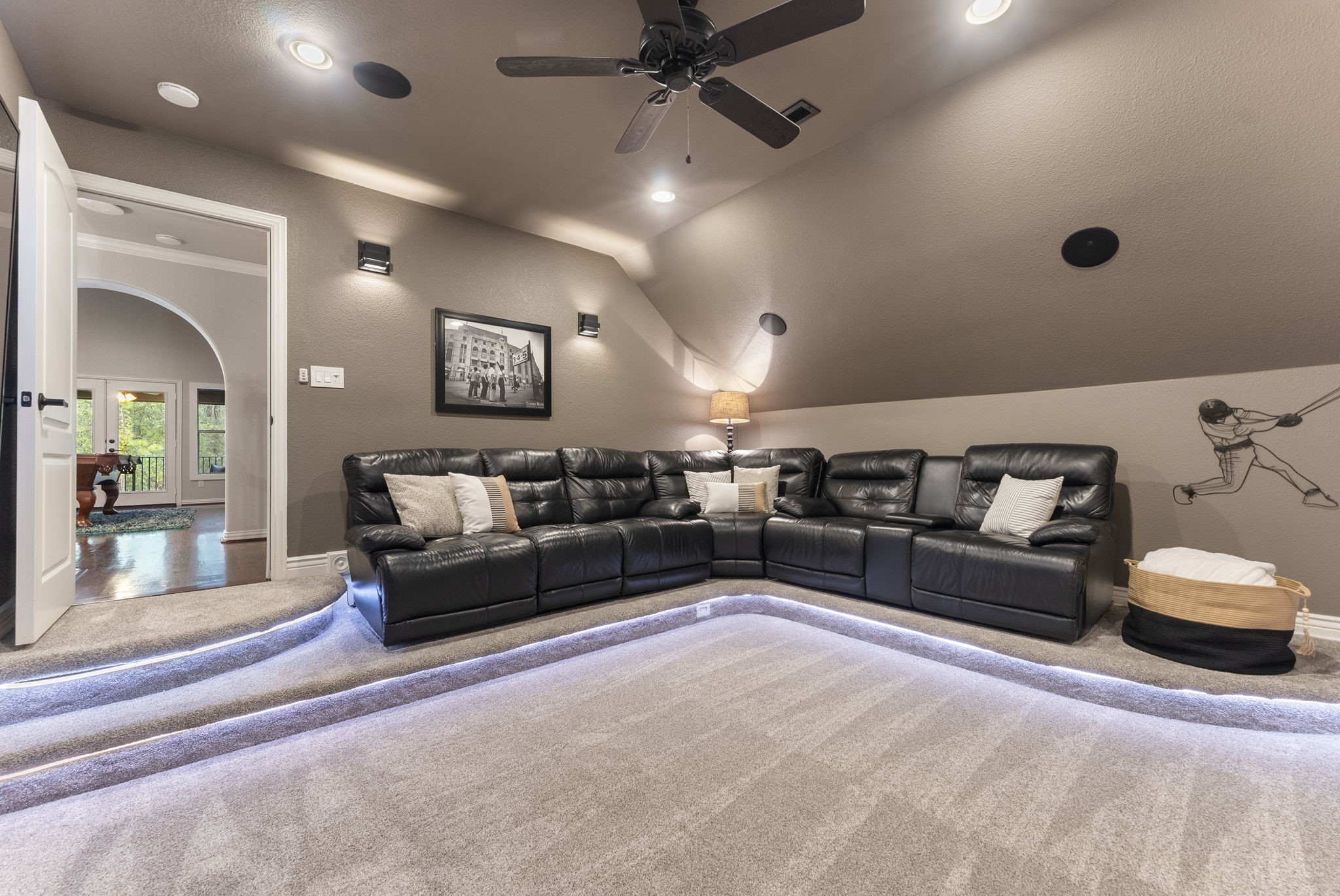 27614 Colin Springs Lane Spring, TX 77386 - Photo 25 of 47 This upstairs GEM of a Media Room is tucked away for privacy and offers a step-down entry, tiered seating with under-step accent lighting, updated carpet, ceiling fan, dimmable wall sconces, surround sound wiring, and a coded entry storage closet!