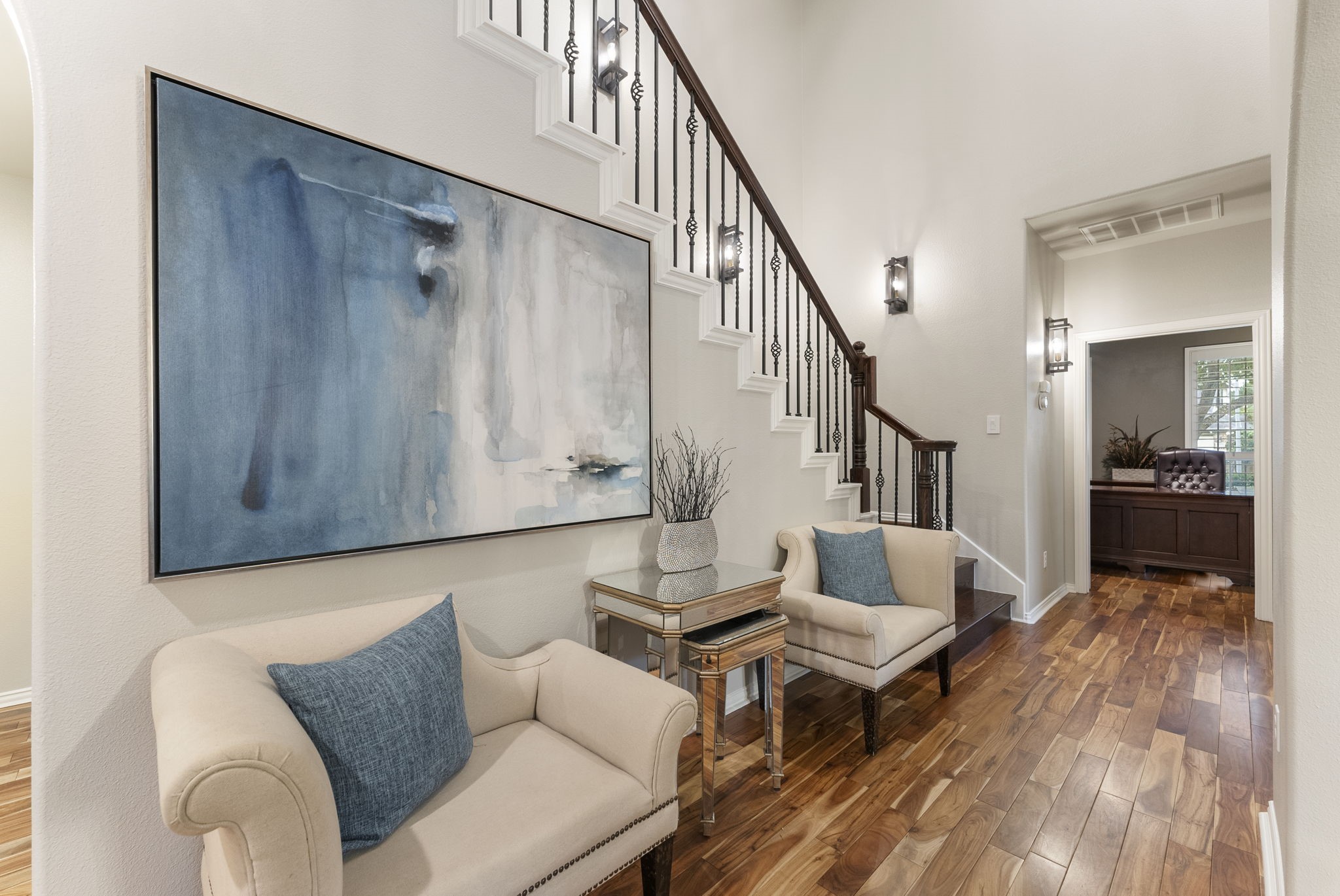 27614 Colin Springs Lane Spring, TX 77386 - Photo 6 of 47 Main hallway with wood flooring, updated lighting, and a soaring two-story ceiling, wide enough to accommodate a separate sitting area!