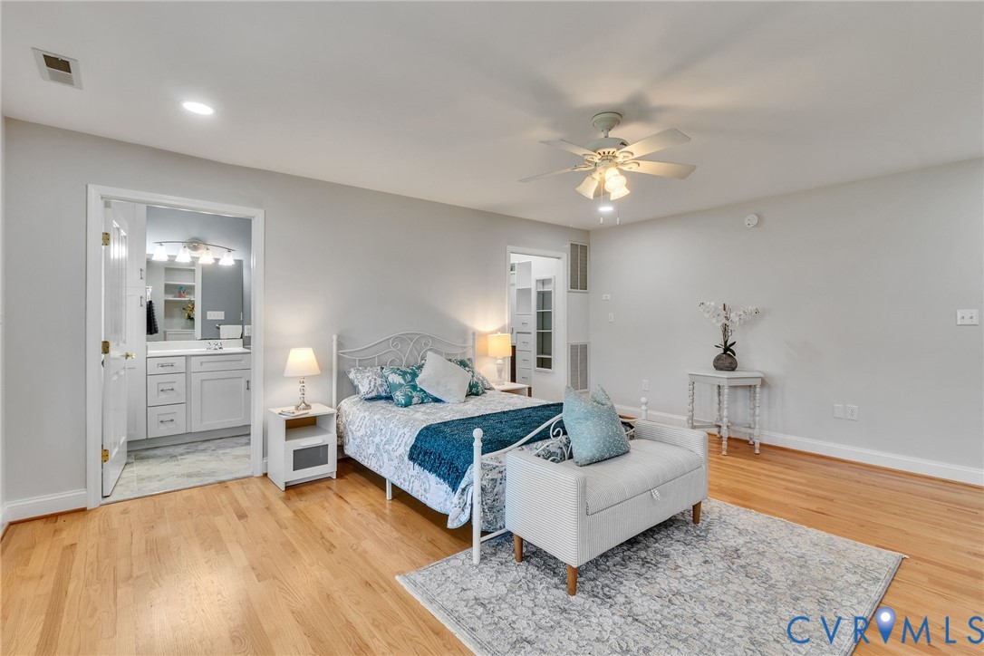 618 Main Street Reedville, VA 22539 - Photo 21 of 54 Light wood flooring with a ceiling fan overhead