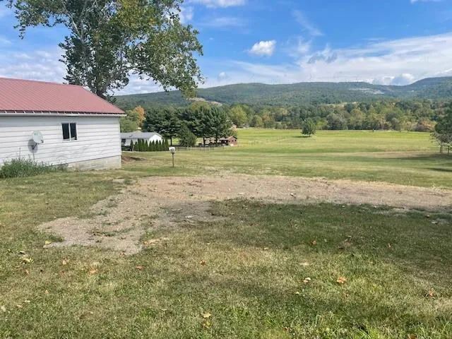 a view of a house with a big yard