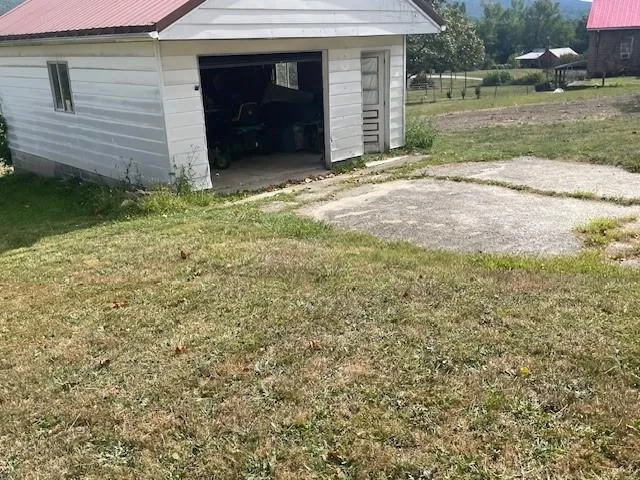 a view of a backyard of the house