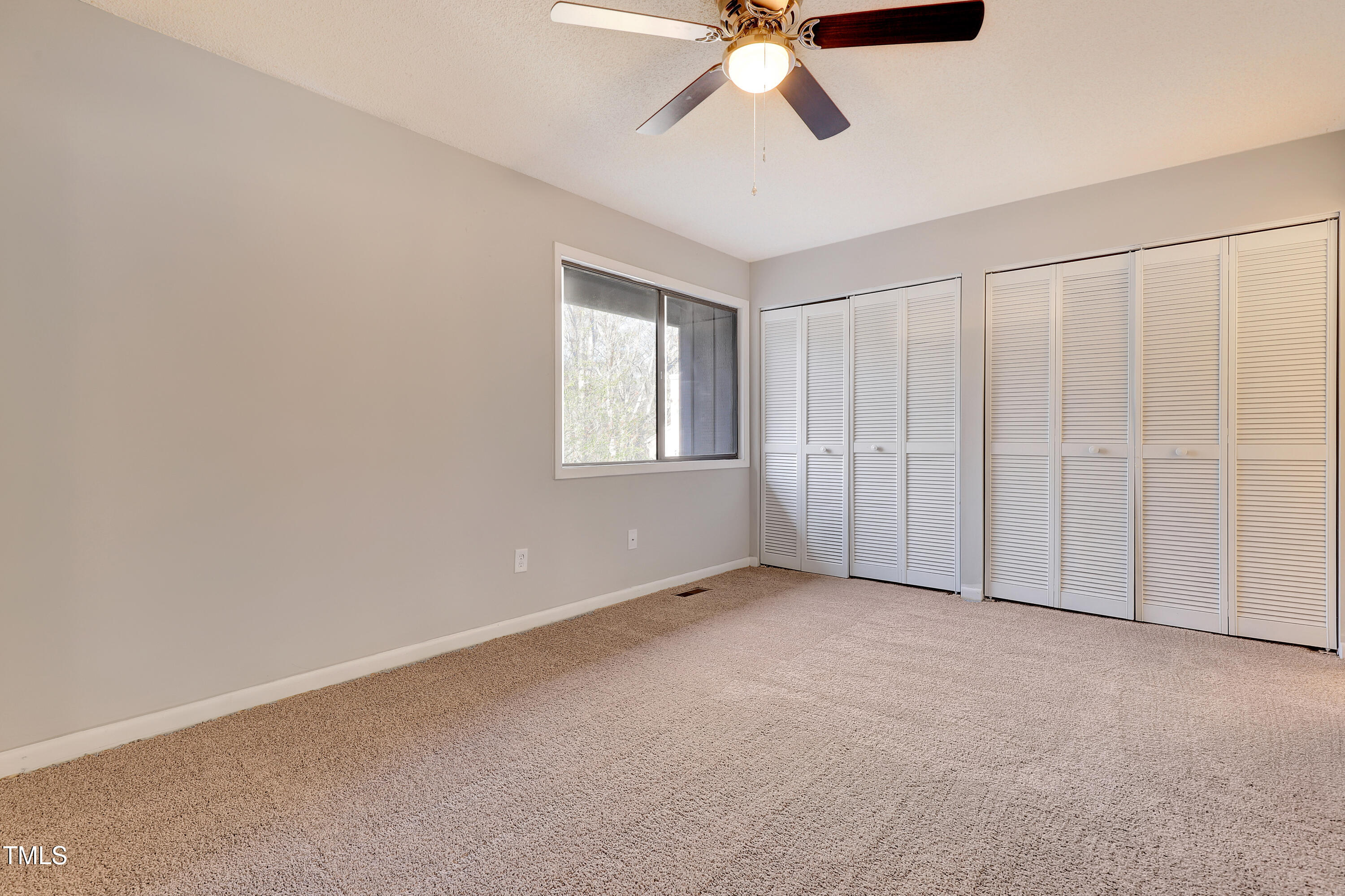196 Ridge Trail Chapel Hill, NC 27516 - Photo 15 of 32 an empty room with chandelier fan