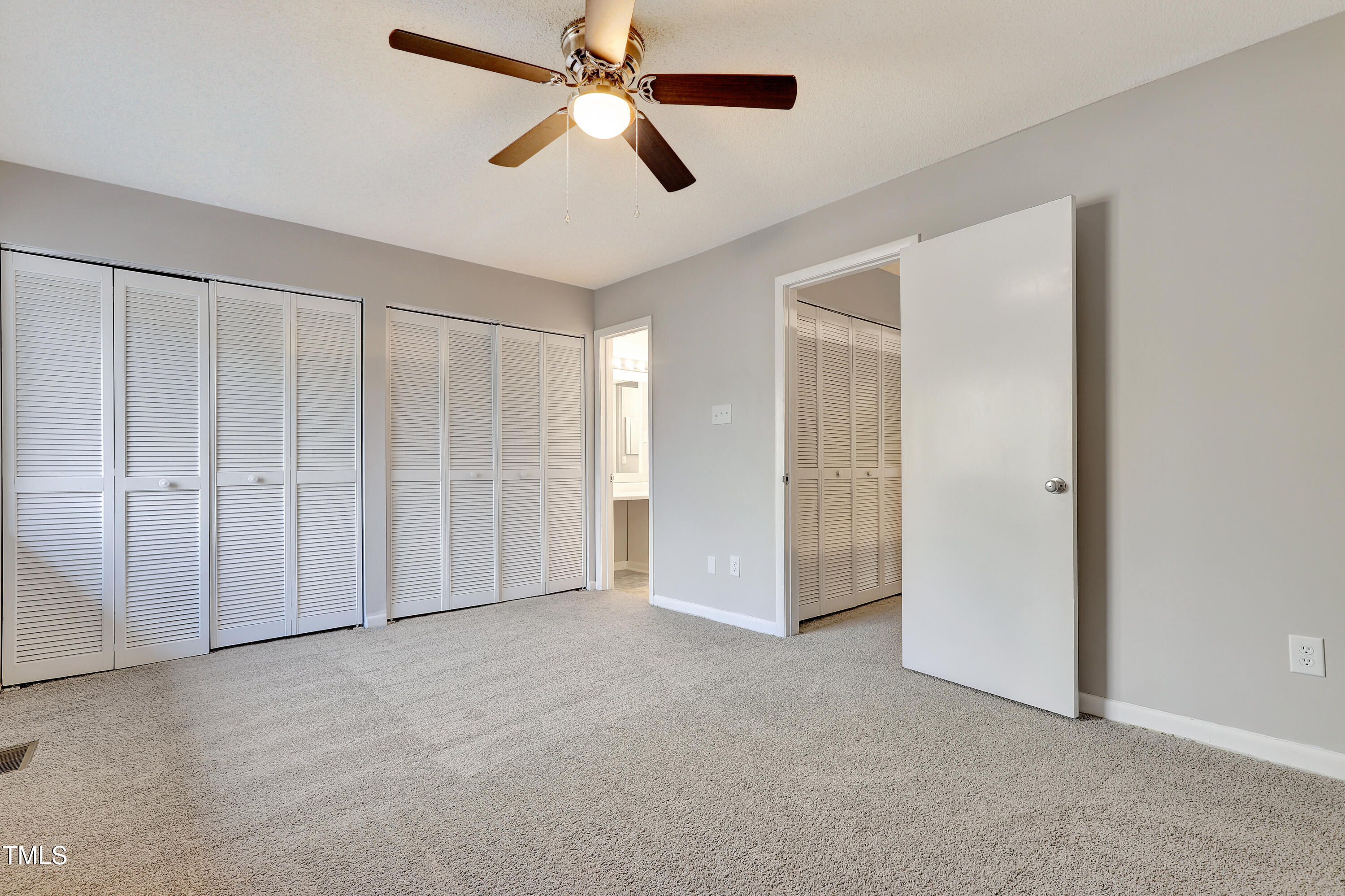 196 Ridge Trail Chapel Hill, NC 27516 - Photo 16 of 32 a view of an empty room with a fan