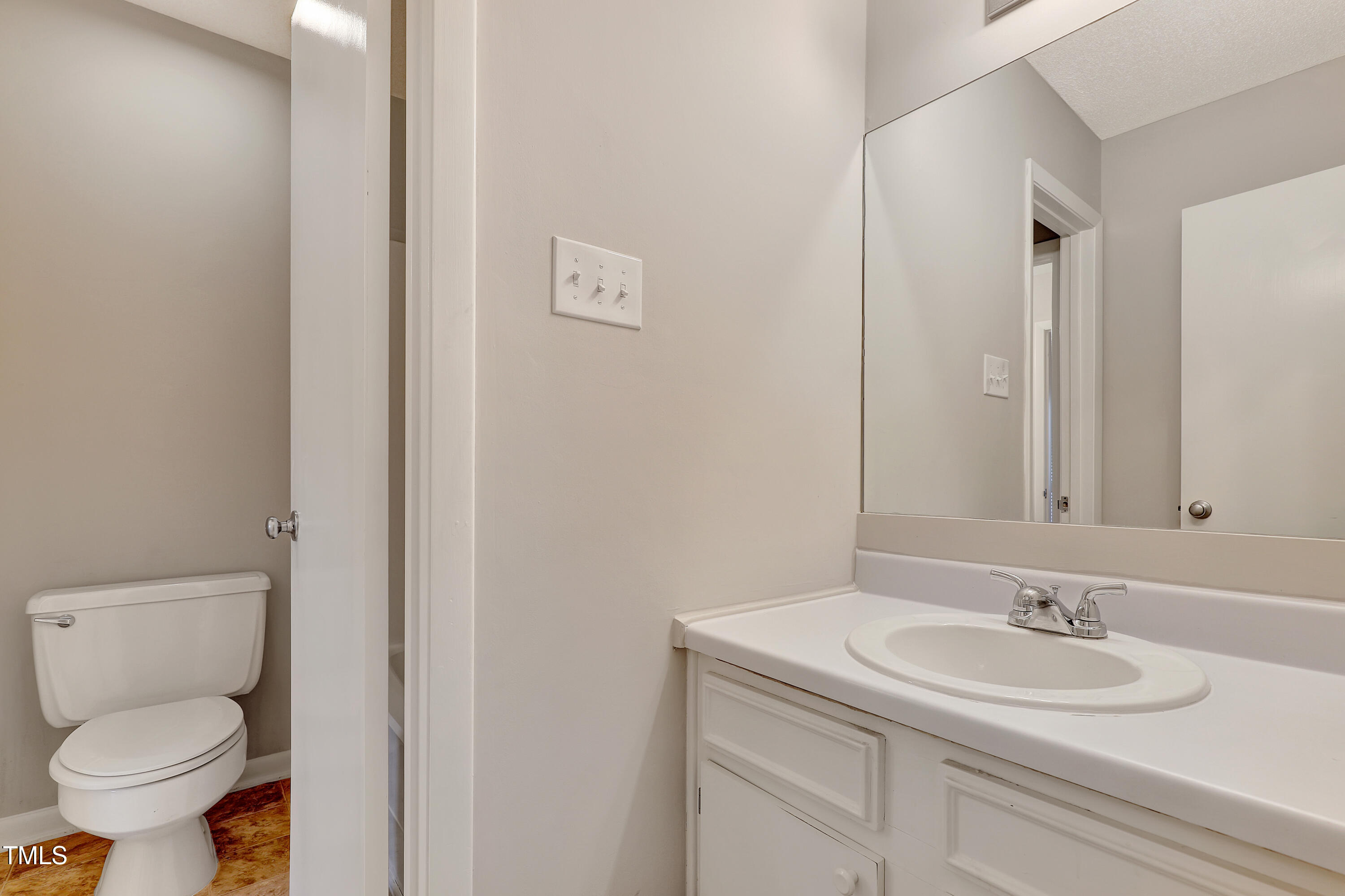 196 Ridge Trail Chapel Hill, NC 27516 - Photo 17 of 32 a bathroom with a toilet sink and mirror