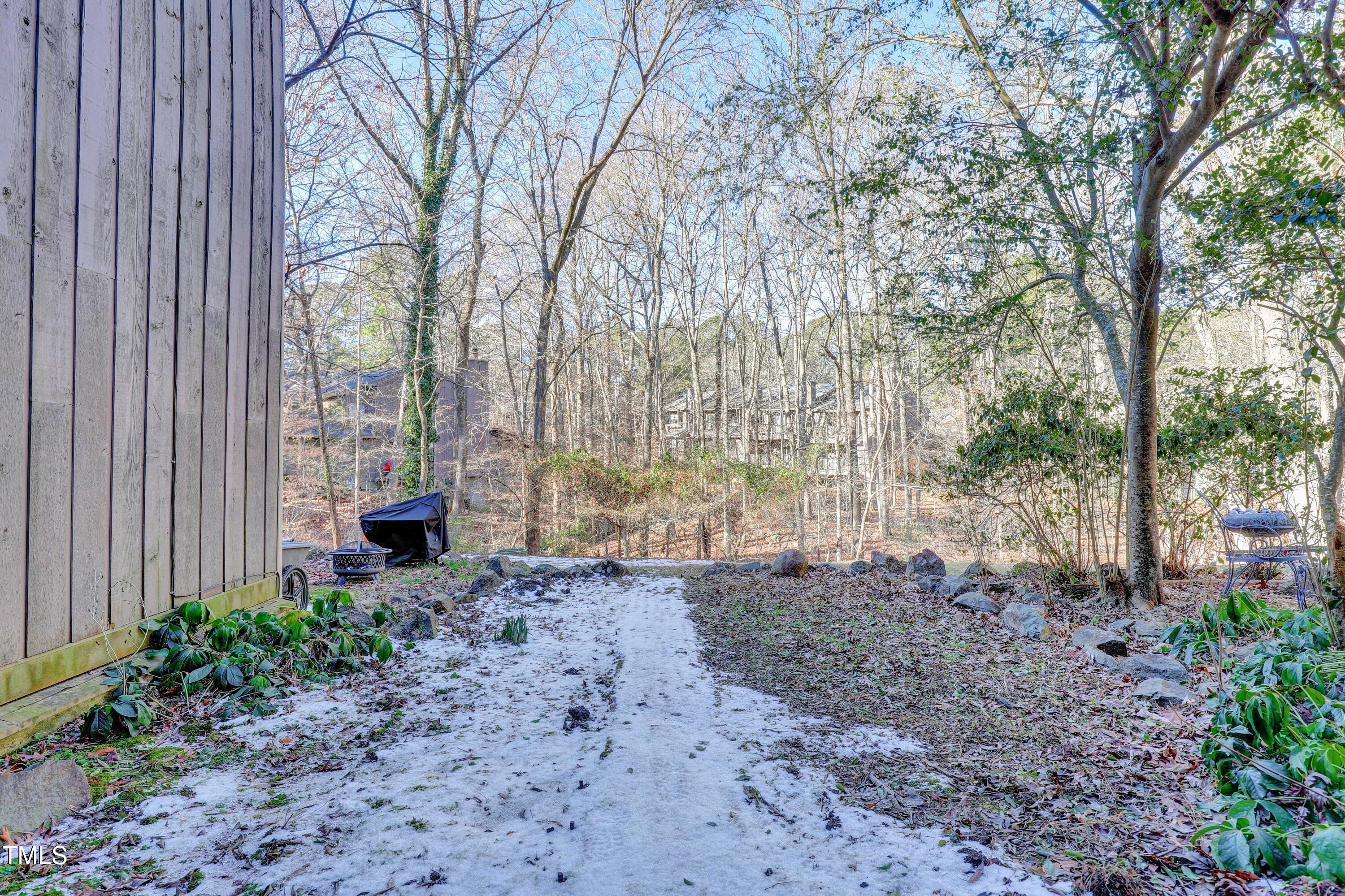196 Ridge Trail Chapel Hill, NC 27516 - Photo 30 of 32 a backyard of a house with lots of green space