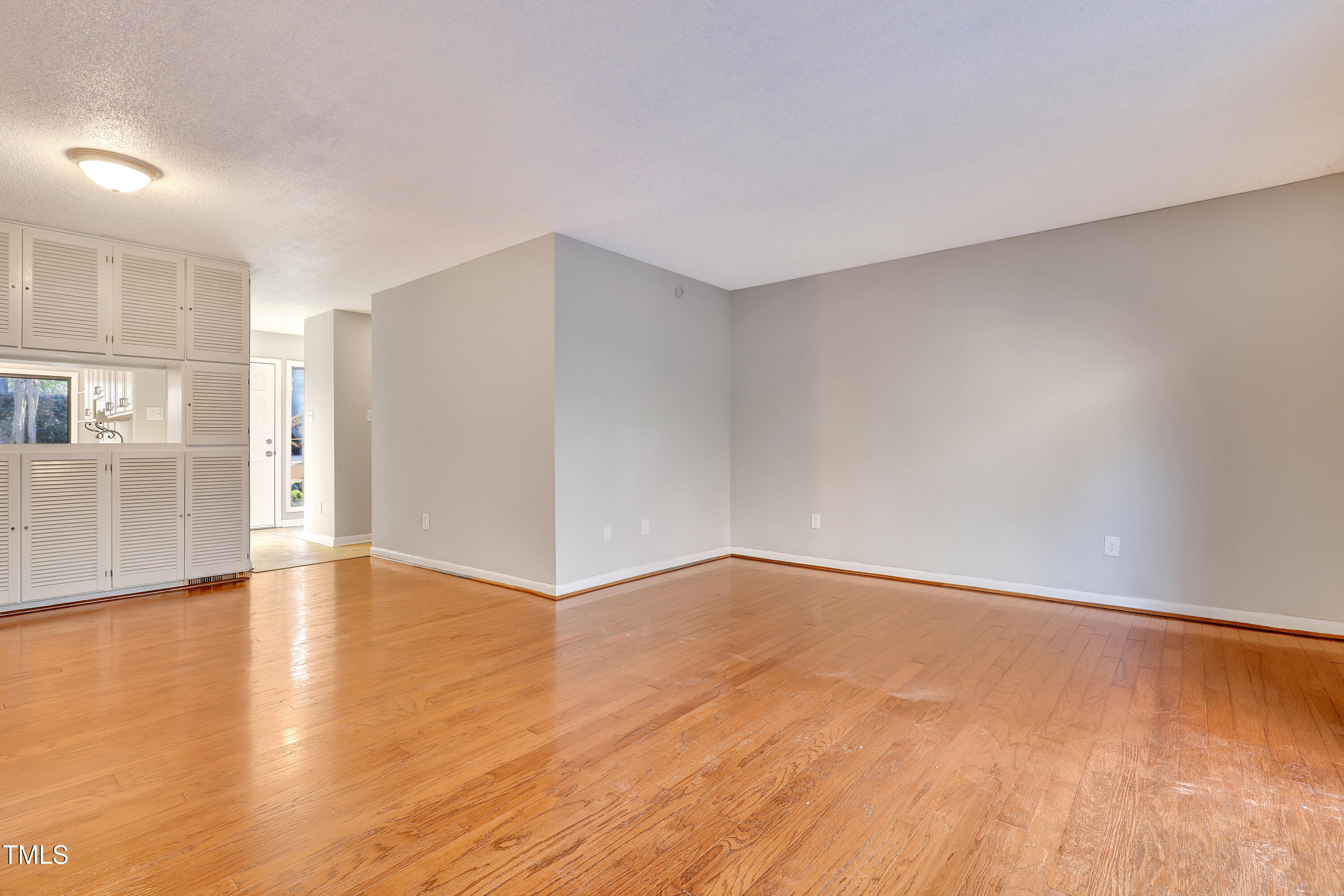 196 Ridge Trail Chapel Hill, NC 27516 - Photo 6 of 32 a view of an empty room with wooden floor