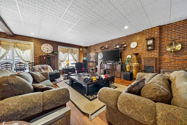 a view of a livingroom with furniture and toys