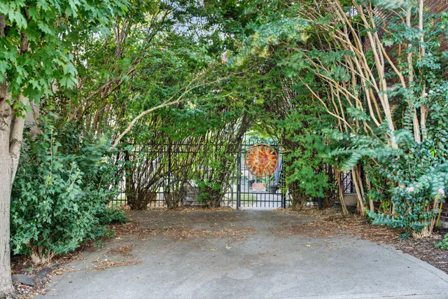 an aerial view of a house with a garden and lake view