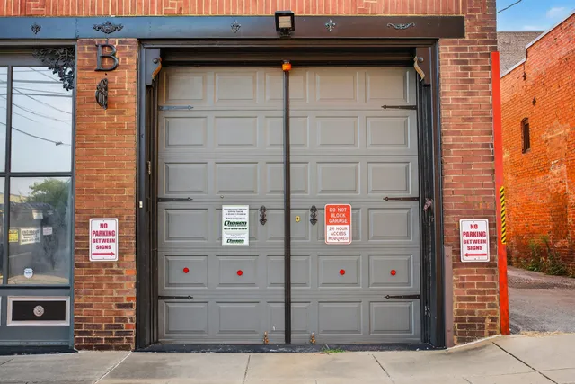 a view of a brick building with a door and a window