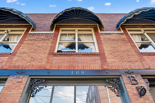 a view of a kitchen with dining table and chairs