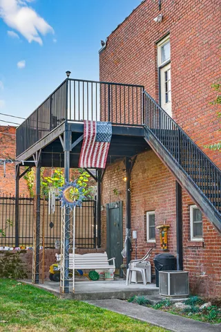 a spacious bathroom with a double vanity sink double mirror and tub