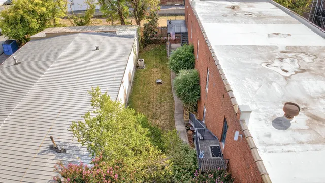 a bathroom with bathtub and window