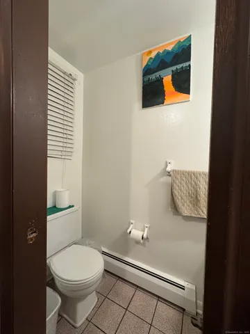 a bathroom with a toilet and a sink