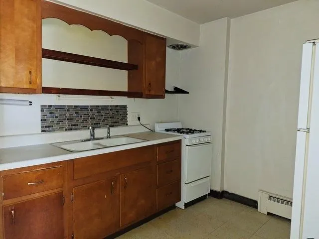 a view of a sink and a mirror