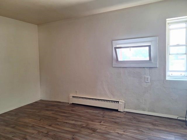 506 Main Street Marseilles, IL 61341 - Photo 10 of 10 an empty room with wooden floor and windows