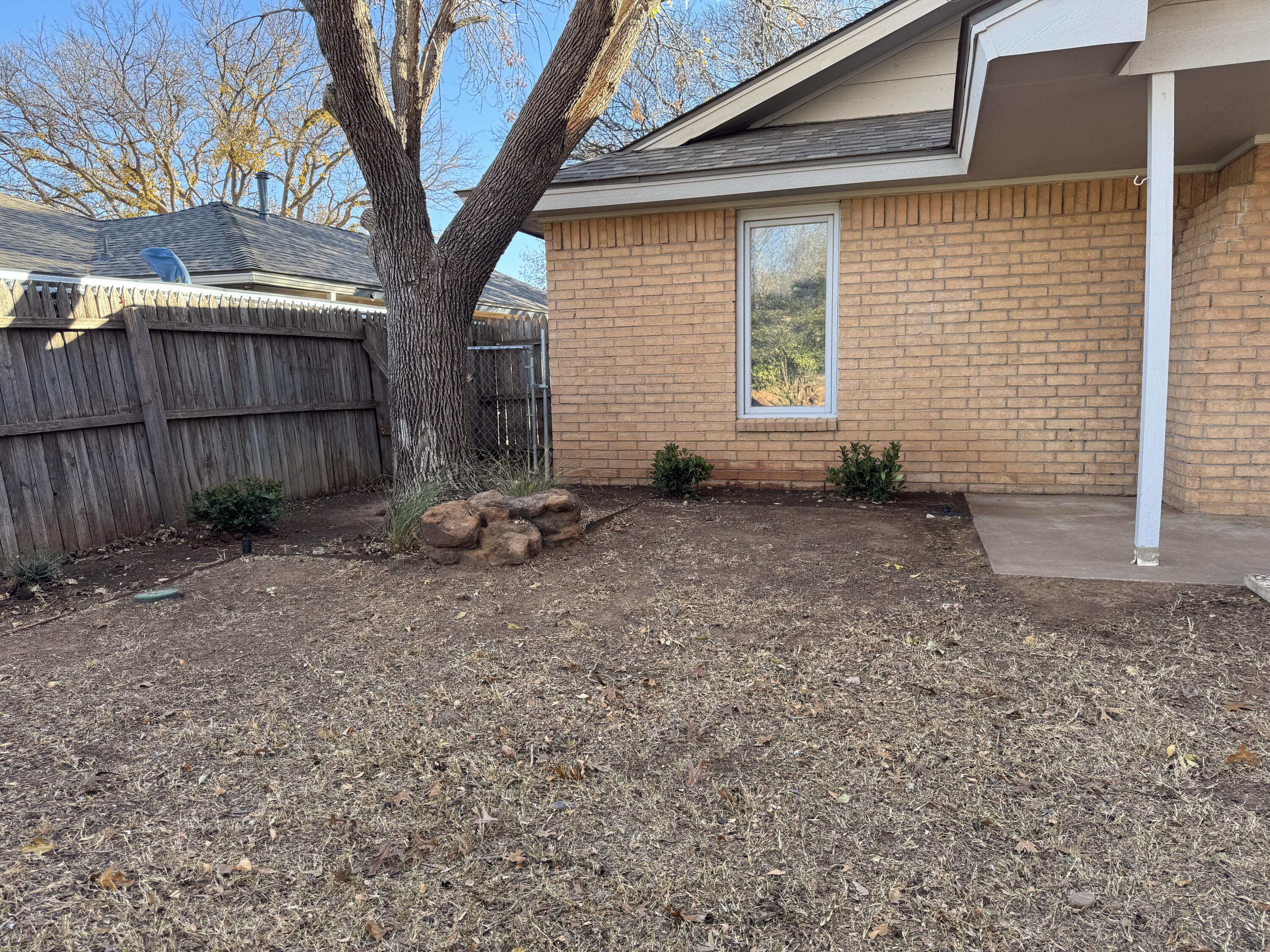 4932 63rd Street Lubbock, TX 79414 - Photo 8 of 14 a backyard of a house