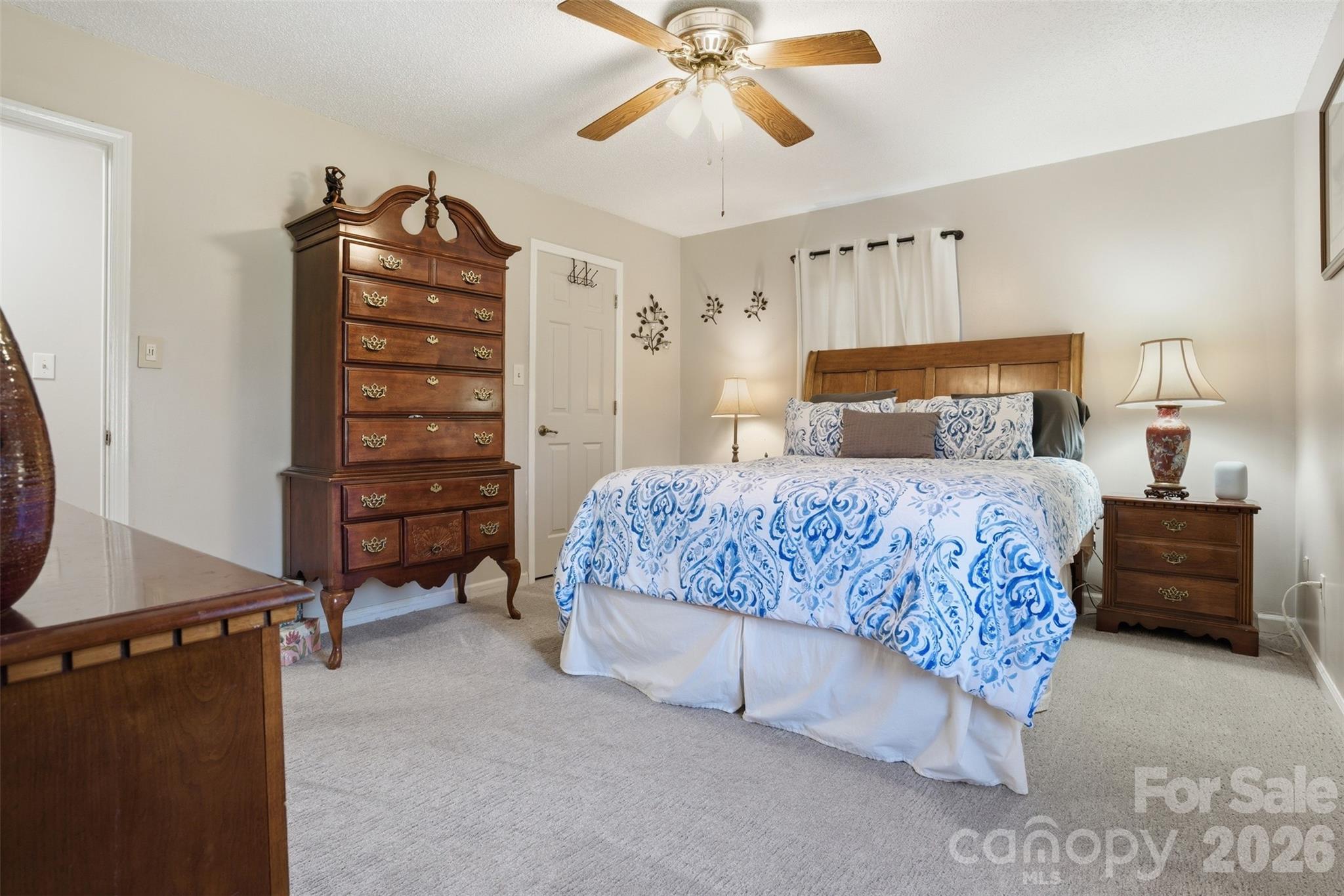 3918 Plum Street Conover, NC 28613 - Photo 11 of 31 a bedroom with a bed and a chandelier