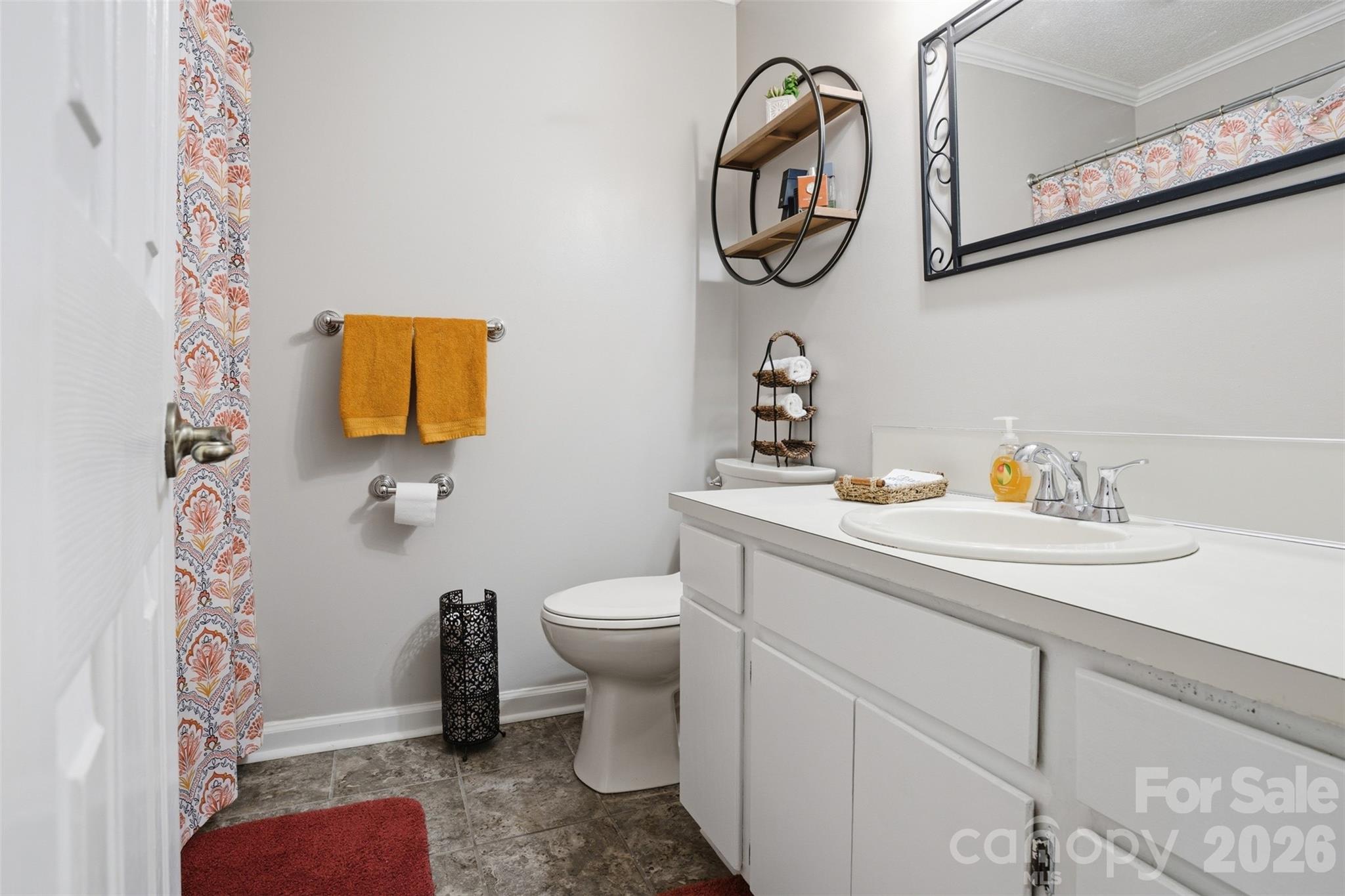 3918 Plum Street Conover, NC 28613 - Photo 17 of 31 a bathroom with a toilet sink and mirror