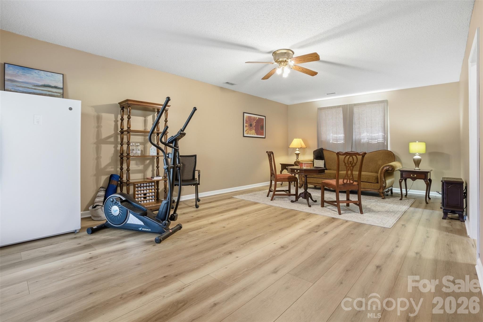 3918 Plum Street Conover, NC 28613 - Photo 20 of 31 a living room with furniture and a wooden floor