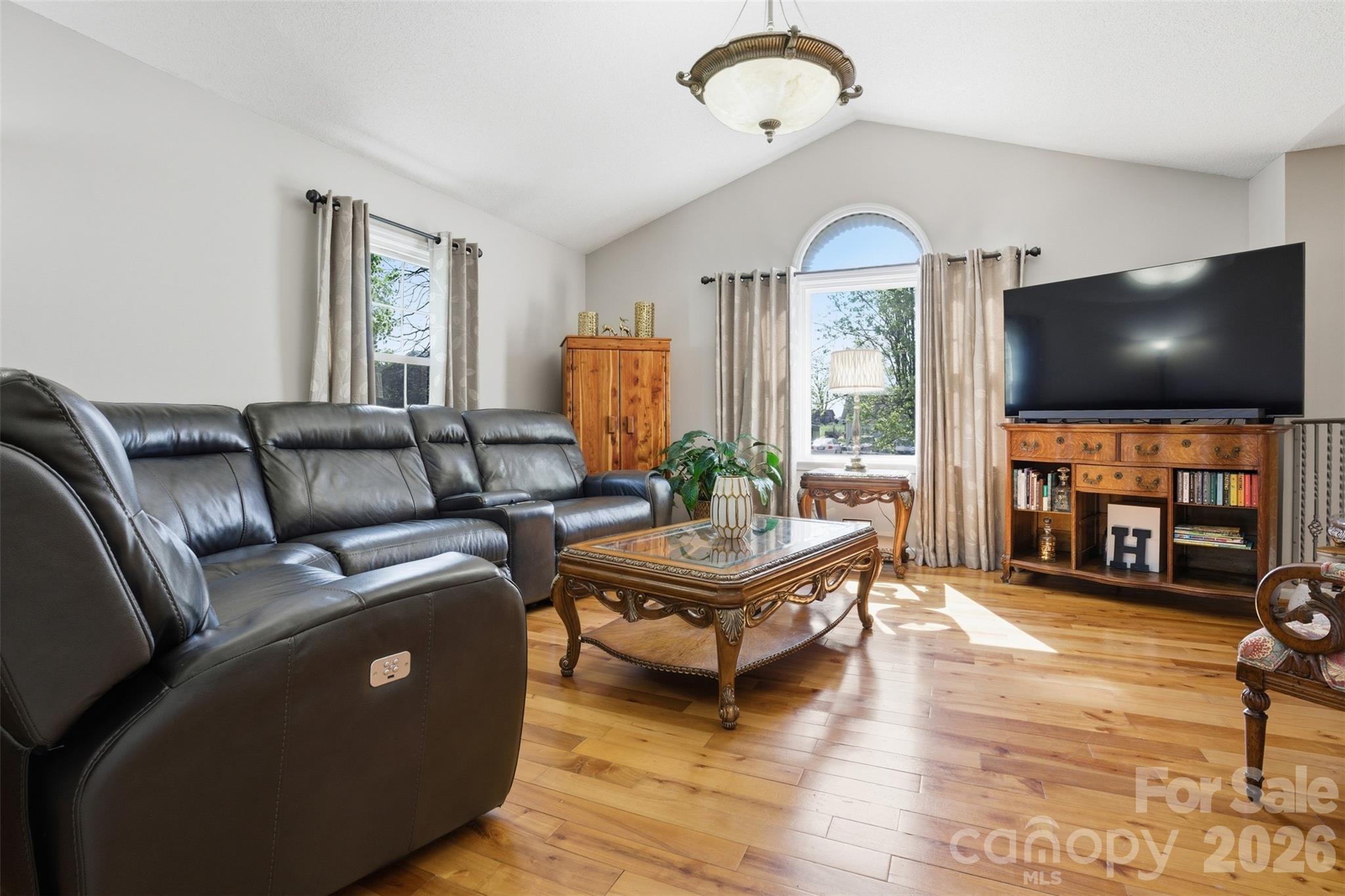 3918 Plum Street Conover, NC 28613 - Photo 4 of 31 a living room with furniture and a flat screen tv
