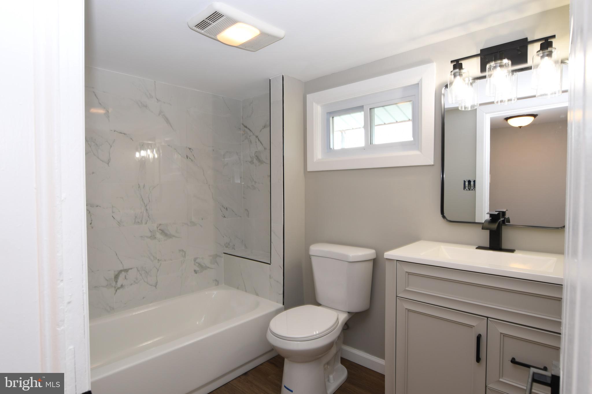 14 Delaware Avenue Salem, NJ 08079 - Photo 11 of 15 a bathroom with a sink toilet and shower
