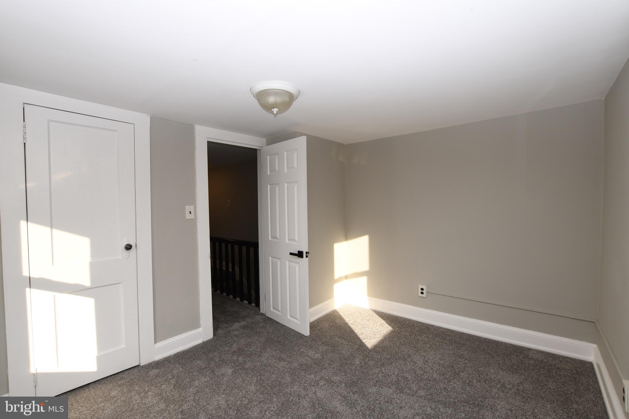 14 Delaware Avenue Salem, NJ 08079 - Photo 12 of 15 an empty room with windows and bathroom view