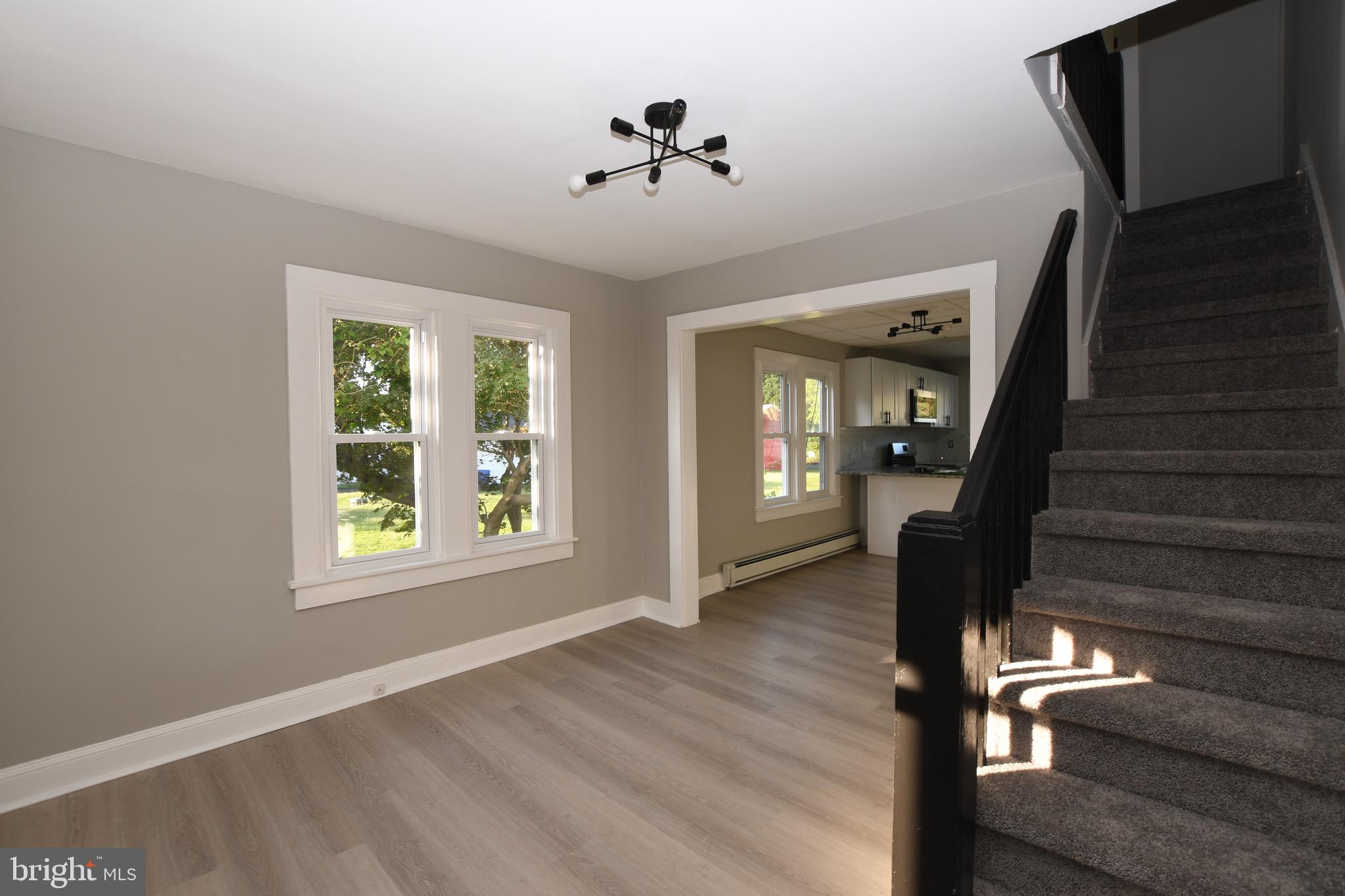 14 Delaware Avenue Salem, NJ 08079 - Photo 13 of 15 wooden floor in an empty room with a window