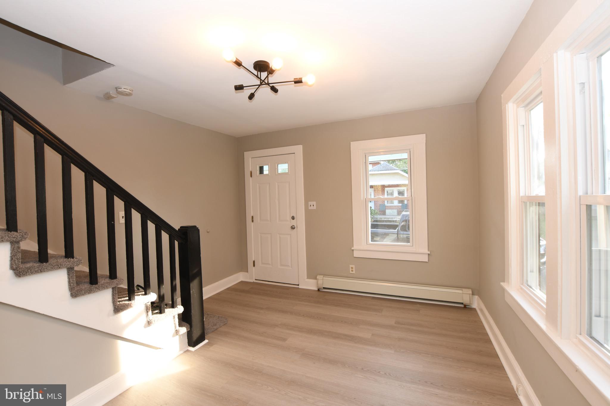 14 Delaware Avenue Salem, NJ 08079 - Photo 7 of 15 a view of an entryway with wooden floor and windows