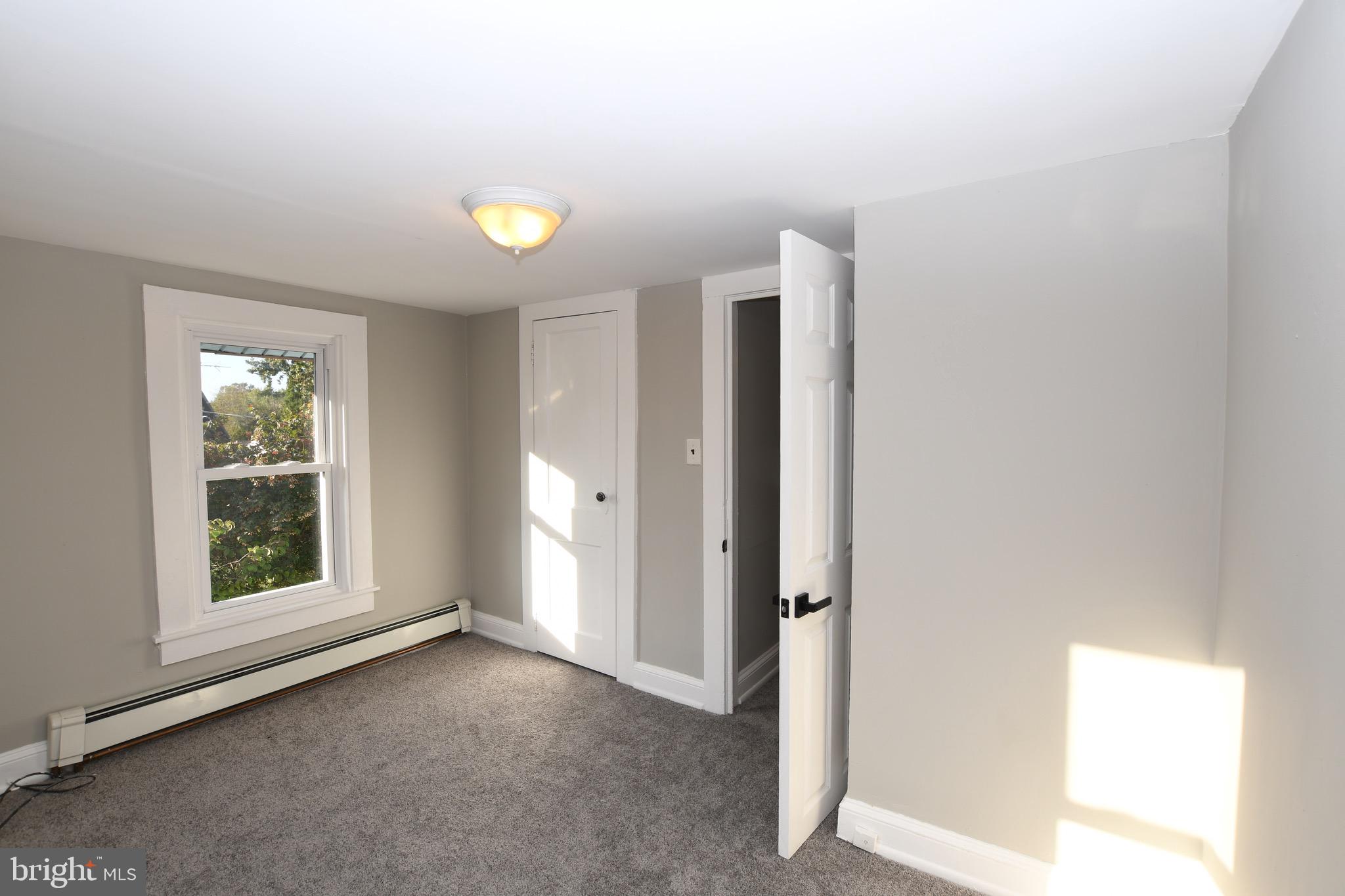 14 Delaware Avenue Salem, NJ 08079 - Photo 9 of 15 an empty room with windows and closet