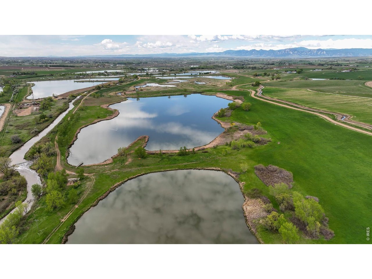 8190 Nelson Lakes Drive Frederick, CO 80504 - Photo 4 of 10 a black and white photo of a lake