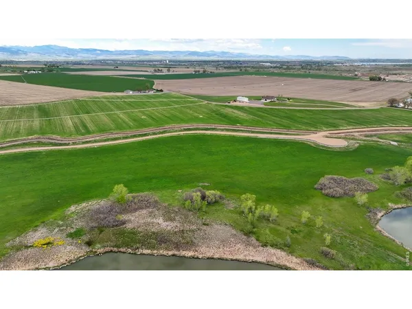 a view of a golf course with a lake