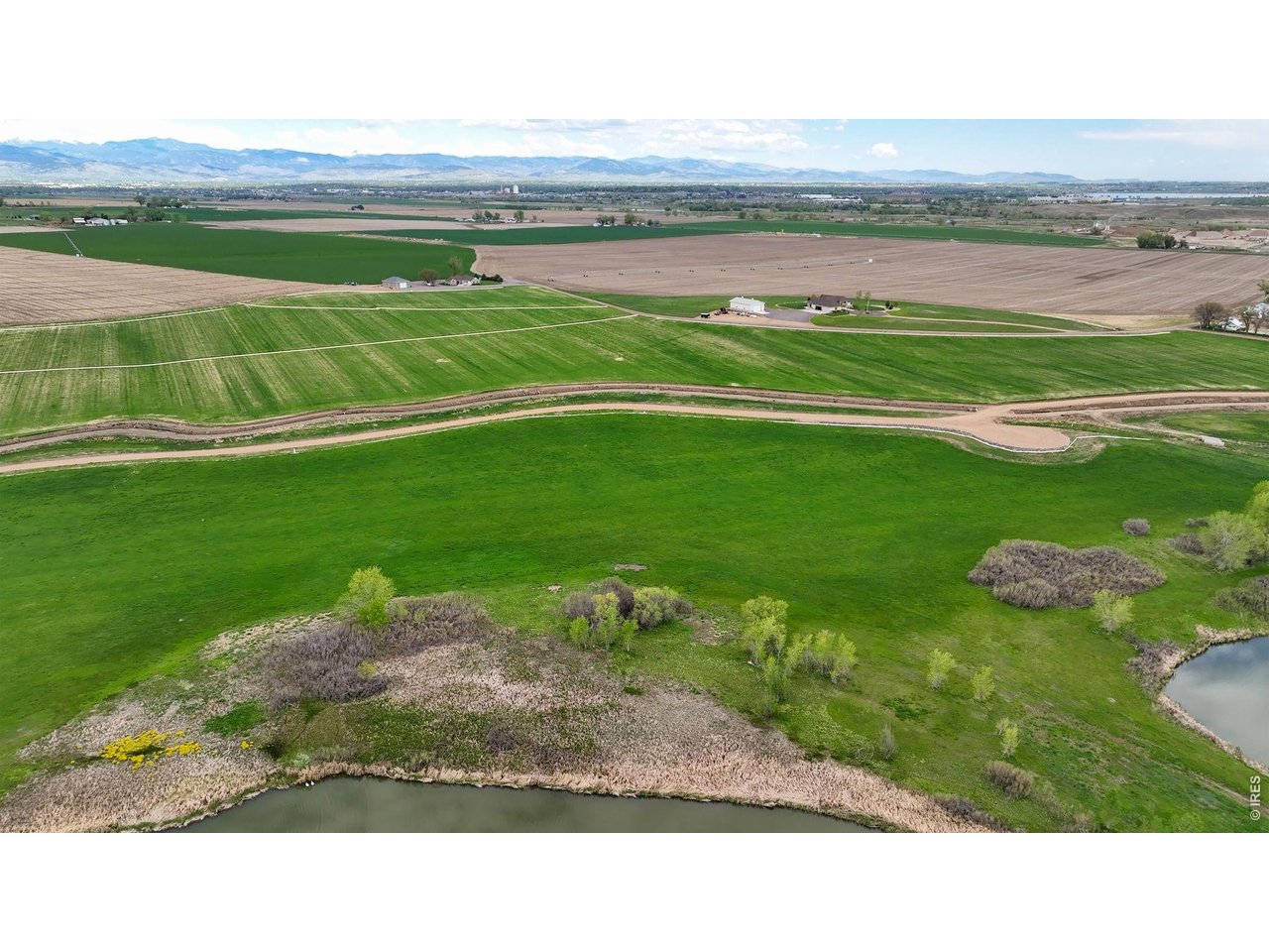 8190 Nelson Lakes Drive Frederick, CO 80504 - Photo 5 of 10 a view of a golf course with a lake
