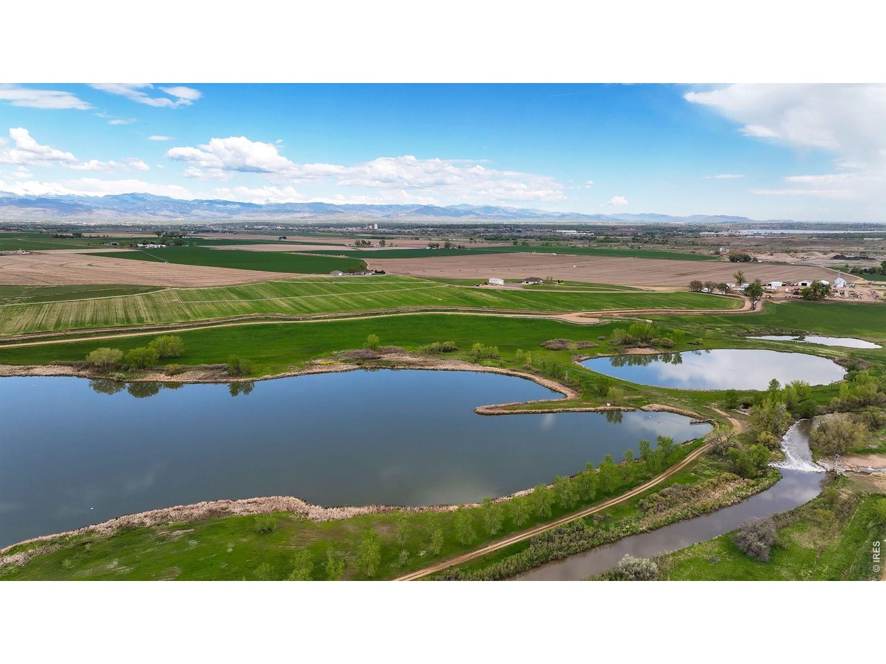 8190 Nelson Lakes Drive Frederick, CO 80504 - Photo 6 of 10 a view of an outdoor space and a lake view