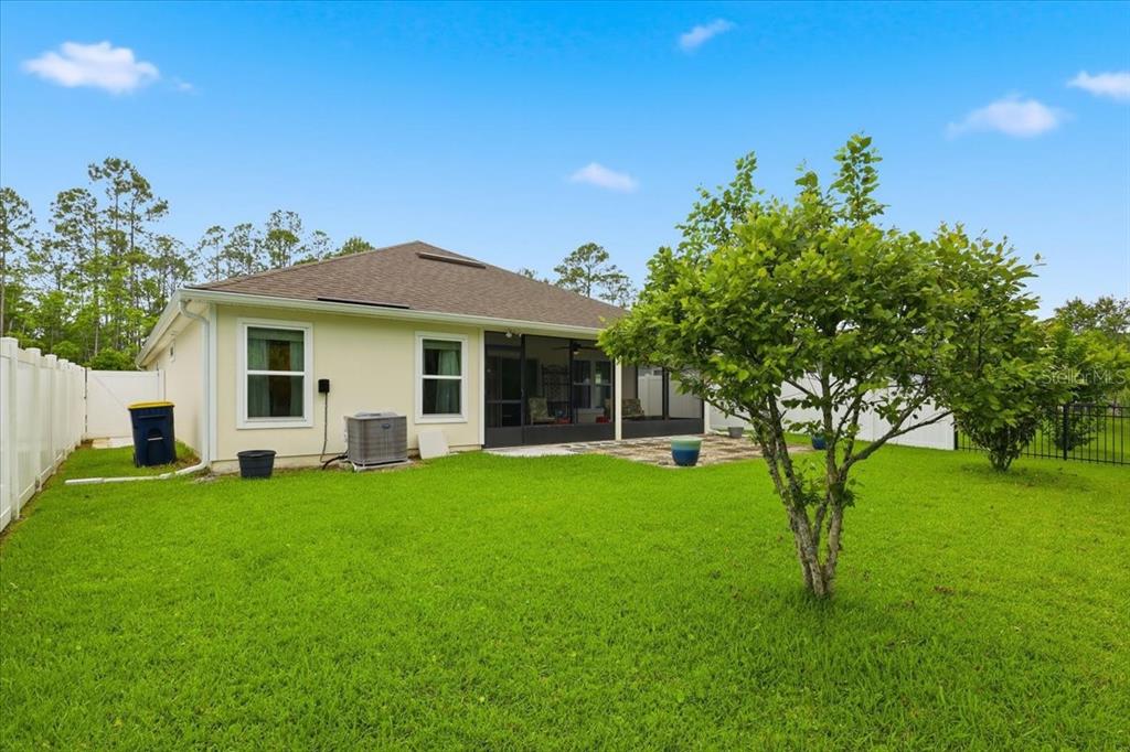 35 Birdie Way Bunnell, FL 32110 - Photo 50 of 57 a view of a house with a backyard