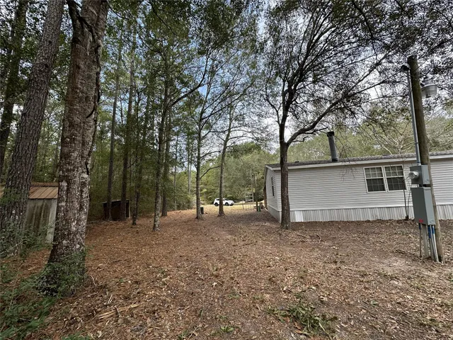 a view of outdoor space and yard