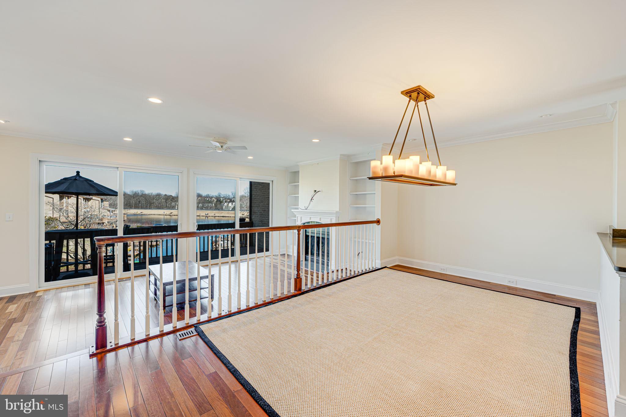 11222 Lagoon Lane Reston, VA 20191 - Photo 3 of 20 a view of a kitchen with furniture and wooden floor