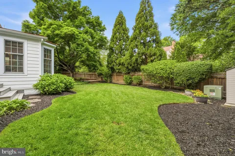 a view of a backyard with a garden