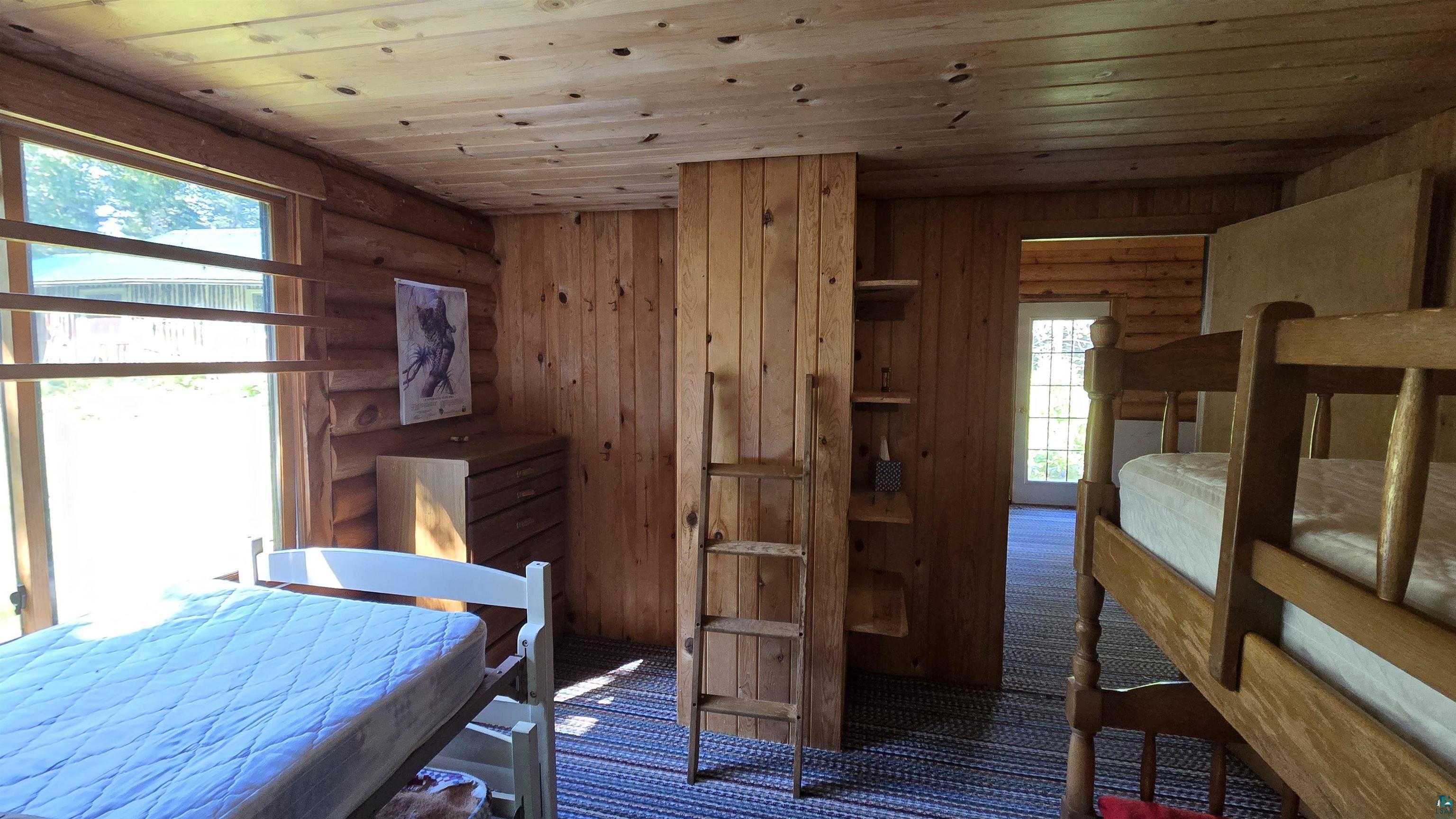 Tbd33 Tbd33 Donovan Point Orr, MN 55771 - Photo 11 of 50 Carpeted bedroom with wood ceiling and log walls
