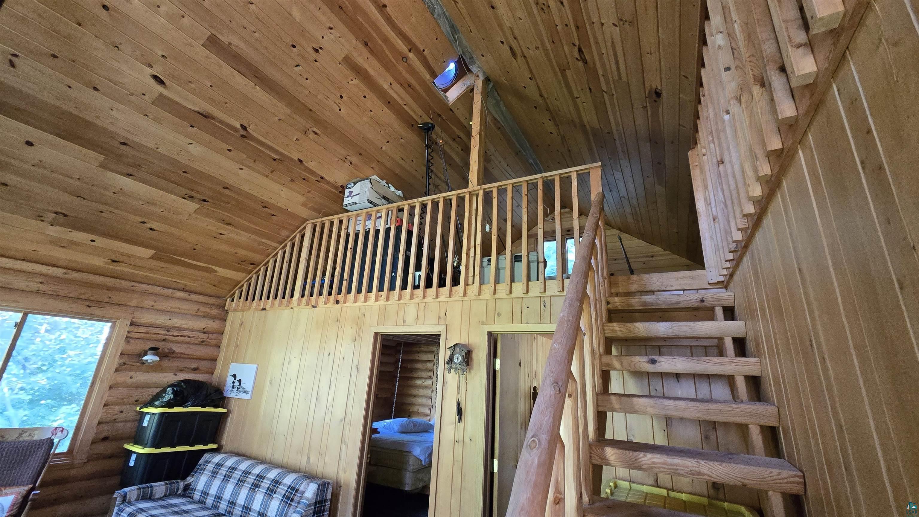 Tbd33 Tbd33 Donovan Point Orr, MN 55771 - Photo 13 of 50 Stairway with rustic walls and a high wood ceiling