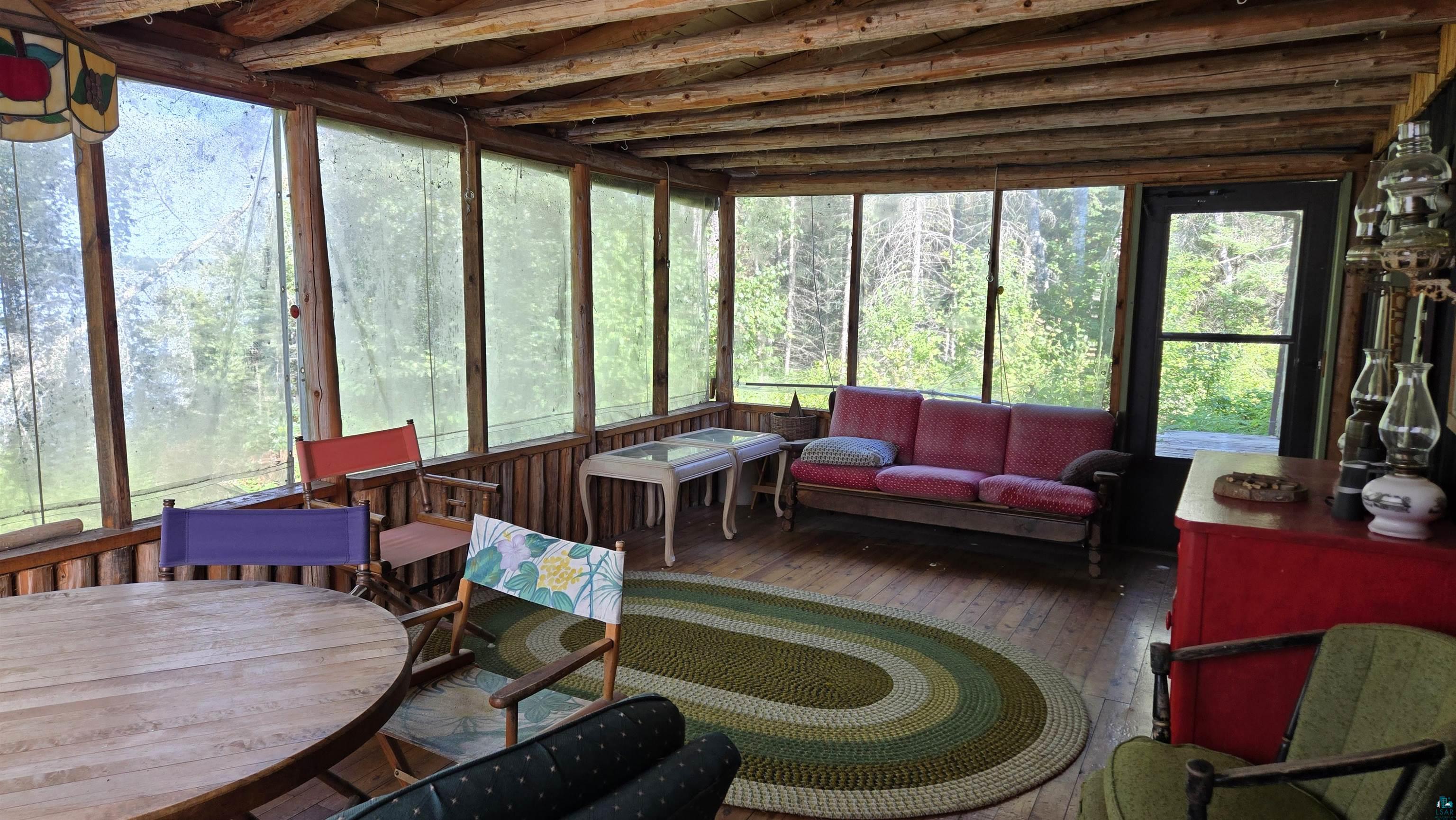 Tbd33 Tbd33 Donovan Point Orr, MN 55771 - Photo 16 of 50 Sunroom / solarium featuring an outdoor living / dining area and a wooden deck
