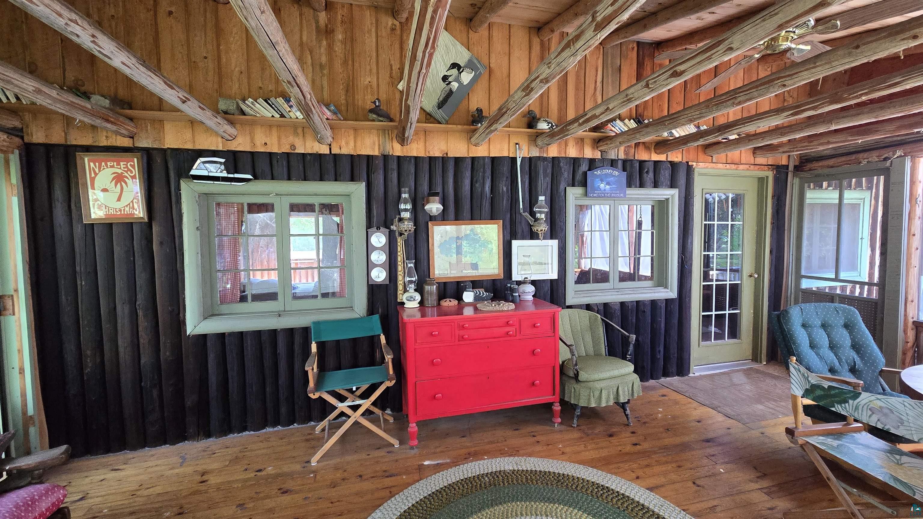 Tbd33 Tbd33 Donovan Point Orr, MN 55771 - Photo 18 of 50 Living area with hardwood / wood-style floors and wood walls