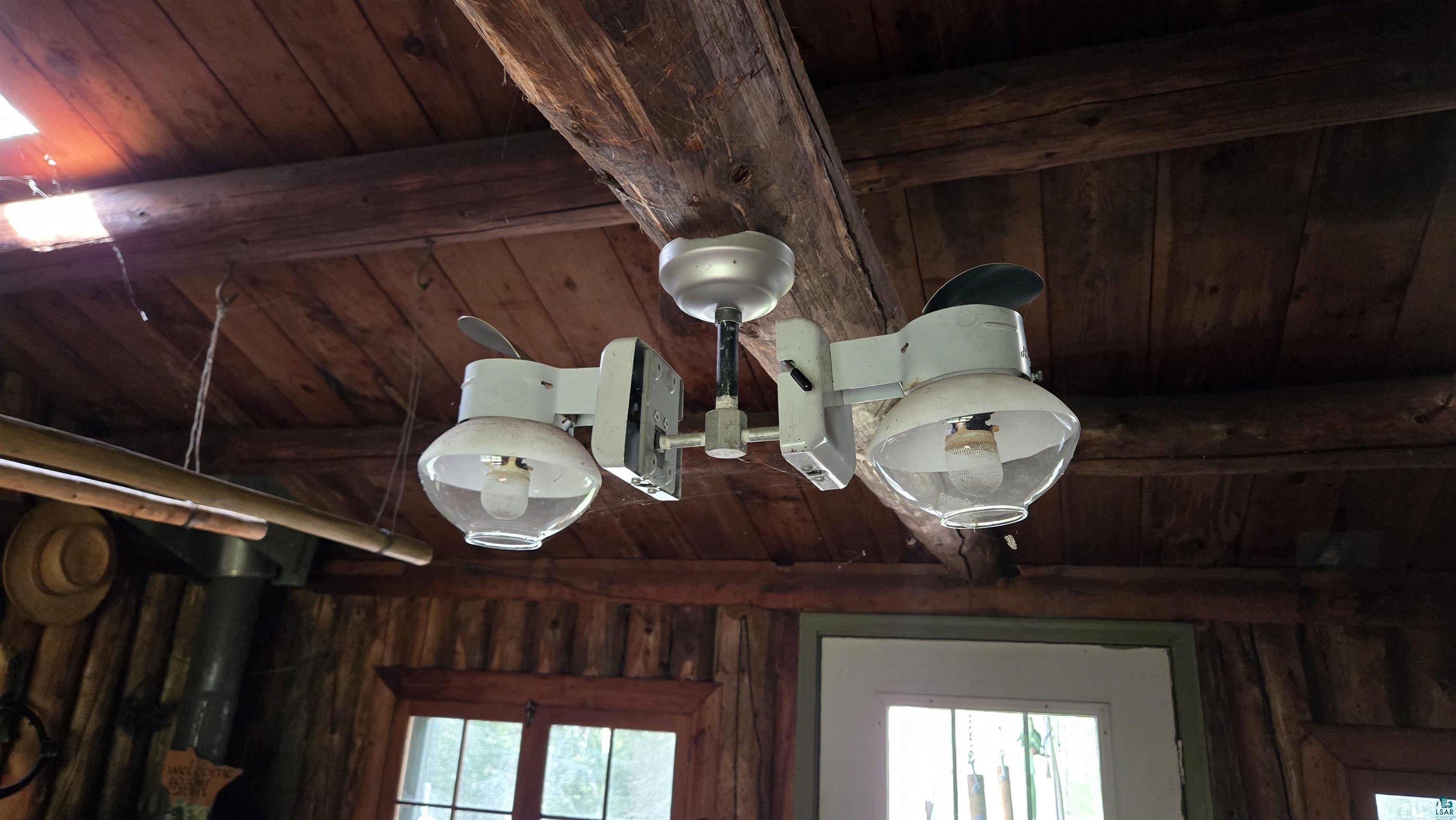 Tbd33 Tbd33 Donovan Point Orr, MN 55771 - Photo 29 of 50 Detailed view of a wooden ceiling with exposed beams and wooden walls