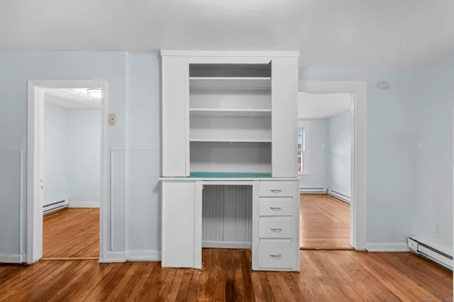 a view of walk in closet with empty racks