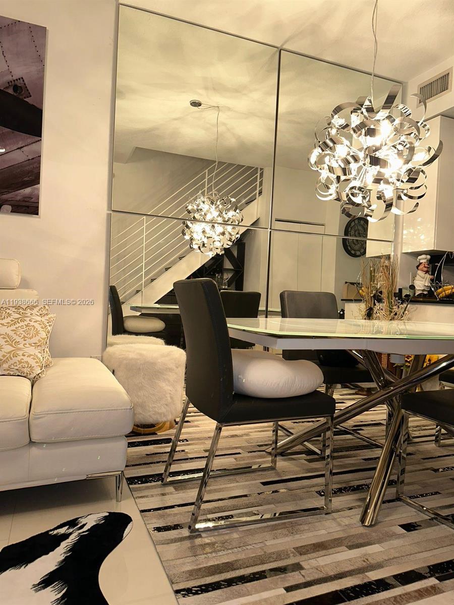 60 Southwest 13th Street, Unit 2422 Miami, FL 33130 - Photo 12 of 33 a bathroom with a sink and a mirror